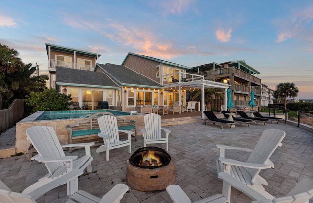 Waterfront home with dock, heated pool, & spectacular views- walk/bike downtown!