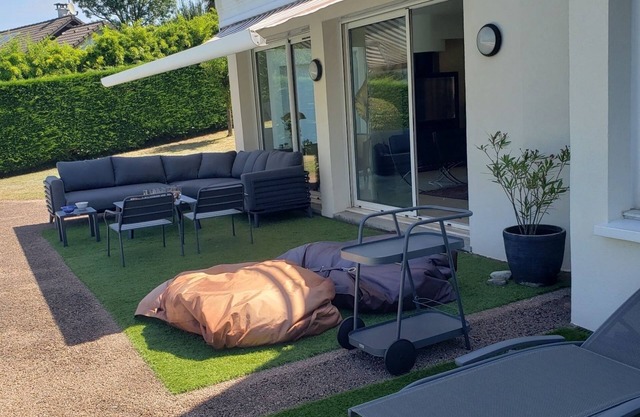 With its feet in the water, this superb contemporary villa