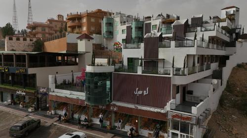 Al Hada Resort | لوسيل للشقق المخدومة