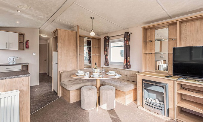 Maryport House | 12ft-wide quality caravan with one double and two twin.