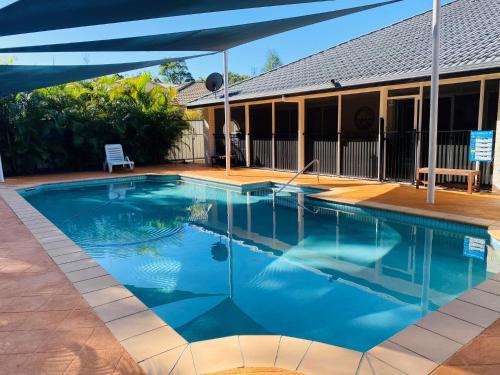 Rainbow Beach House | 29 Satinwood Drive - Rainbow Shores. Pets. Pool. Wifi
