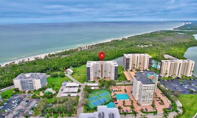 Vanderbilt Beach Condo | 6th Floor End Unit -Bay Side -With Gulf Views and Walk to Vanderbilt Beach!