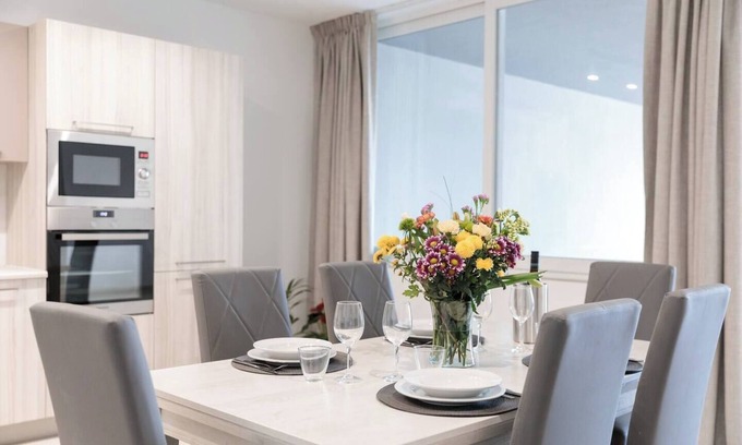 Għadira Apartment | 🌴 9ten11 Maisonette – Ground-floor seafront stay with large patio, modern interiors & direct access to Mellieha Beach 🐚☀️ Perfect for families, couples & business trips.