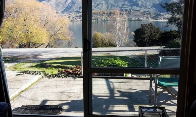 Wanaka House | Absolute Lakefront quirky sixties Unit, spectacular lake and mountain views.