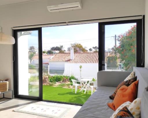Areias de Sao Joao Apartment | Airy 3br, AC, Garden, 2min Strip, 8min Oura Beach