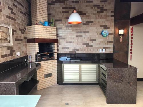 Enseada Azul Apartment | Apartamento com área externa na Bacutia - uma quadra do mar