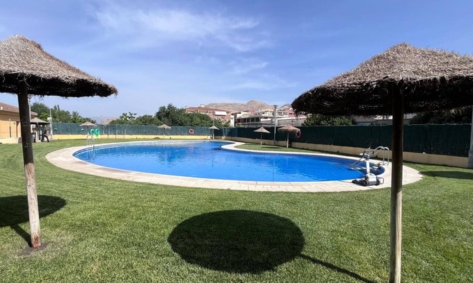 Atarfe Apartment | Apartment 'Ágora' with Mountain View, Shared Pool and Air Conditioning