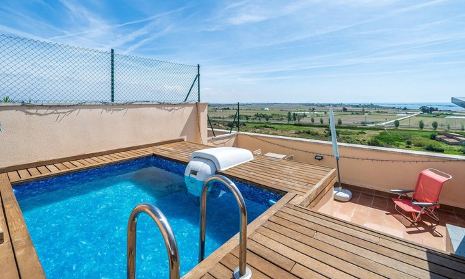 Sant Carles de la Rapita Apartment | Apartment "Ático Oscar" with Sea View, Private Pool & Wi-Fi