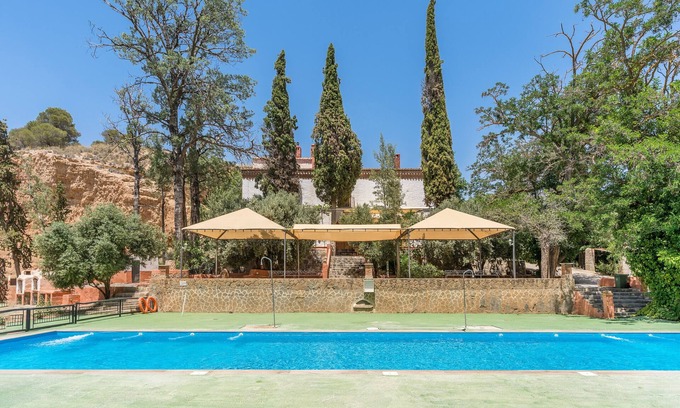 Guadix Apartment | Apartment 'Cueva La Olvidada' with Mountain View, Shared Pool and Wi-Fi