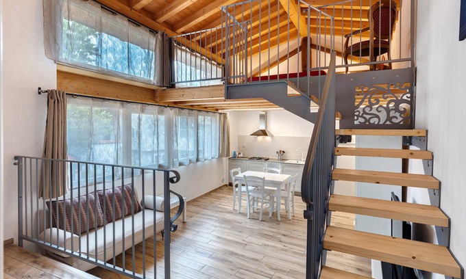 Portese Apartment | Apartment 'Soppalco - Isola Trimelone' with Shared Pool, Wi-Fi and Air Conditioning