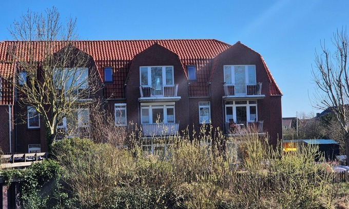 Dornumersiel Apartment | Apartment Meerzeit with sea view and sunny balcony, wifi, village center, 2 persons