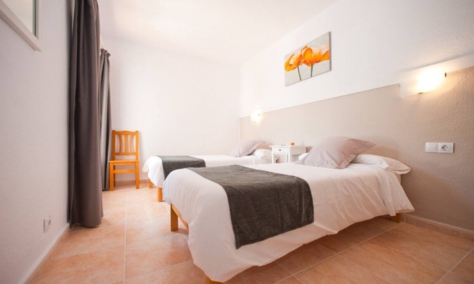 Santa Eulalia del Rio Apartment | Apartment Ses Veles 1 dormitorio close to the Beach with Sea View, Pool, Wi-Fi & Garden