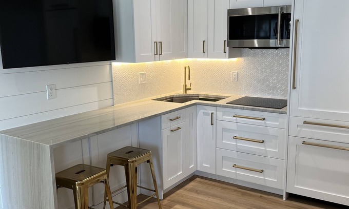 Avalon Condo | AVALON BEACH BLOCK! Renovated, Luxury condo W/heated pool steps to everything