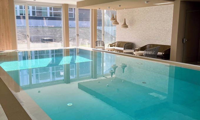 Bad Saarow Apartment | Bad Seerose, cozy vacation apartment with lake view, roof terrace, pool and sauna
