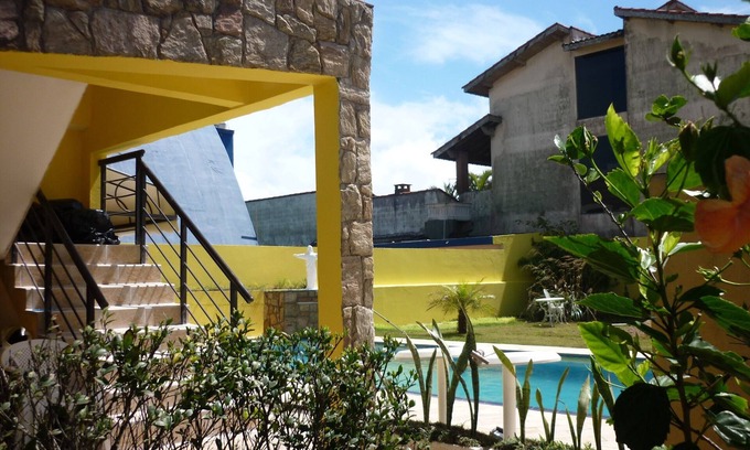 Peruibe House | BEACHFRONT TOWNHOUSE 04 BEDROOMS, LIVING ROOM, KITCHEN, BARBECUE. SWIMMING POOL.