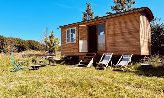 Oetzen Cabin | Beautiful circus wagon on the sheep pasture