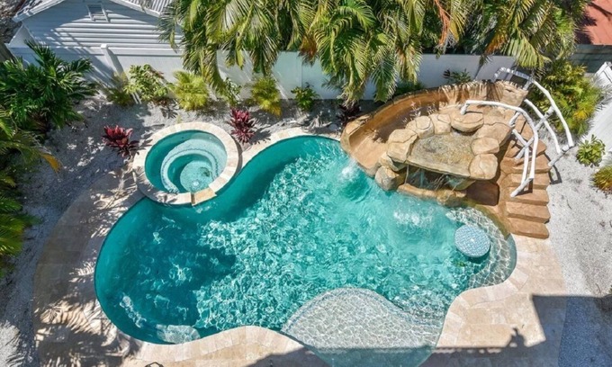 Bradenton Beach House | Beautiful Home with Pool, Waterslide and Spa! Gulf and Bay Views, Rooftop Deck -