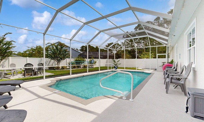 Palm Coast House | Beautiful house with heated pool, full kitchen, central AC, and washer/dryer