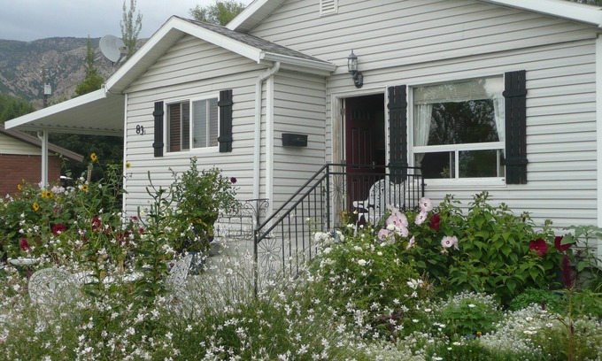 Brigham City House | Beautiful small Garden Surrounding This Little Home. Clean and Comfortable.