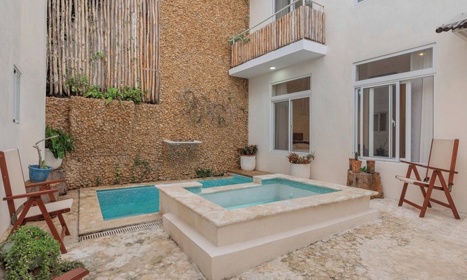 Zona Colonial Apartment | Bohechio studio with private balcony, pool views, ensuite bath, and kitchen.
