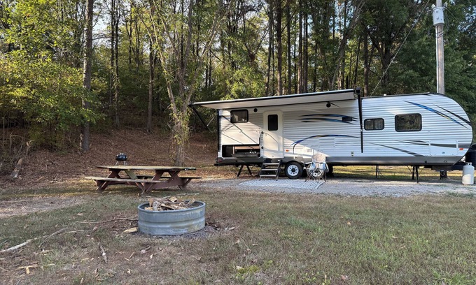 Jacob RV Rental | Camper in country setting beside water, near Burning Star Wildlife area