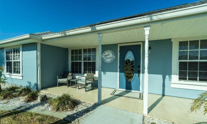 South Gulf Cove House | Canal Dreams a Gorgeous 3 BR/2 BA home with heated pool on the canal