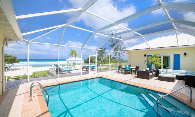 Old Man Bay House | Cayman Sands: Secluded Beach Villa with Pool Atrium & Guest Cottage