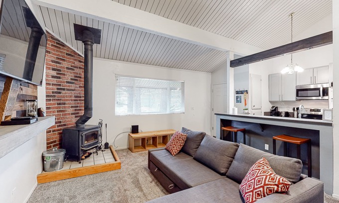 Mammoth Lakes Condo | Charming, two-story ski condo w/a wood stove, free WiFi, shared pool, & hot tub