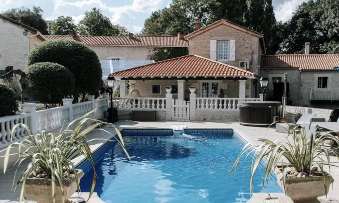 Chenon House | Charming updated and 4-bedroom mill house on the river with fantastic views.