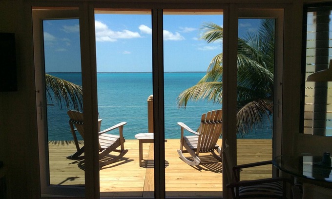 Green Turtle Cay Cottage | Coco Nut Tree House is nestled in Tropical Foliage on Crystal Clear Sea of Abaco