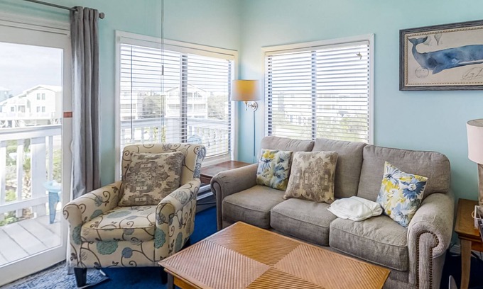 Fort Morgan Condo | Colorful, lofty condo with balcony, beach access, pools, hot tubs & tennis