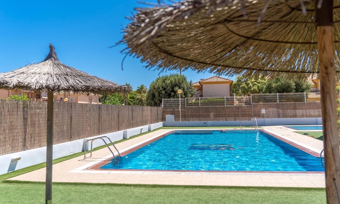 Santiago de la Ribera Apartment | Comfortable apartment with shared pool near the beach.