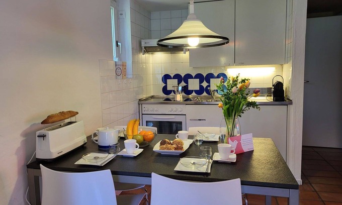Capriasca Apartment | Cosy apartment for 5 guests with WIFI, pool, TV, patio and pets allowed
