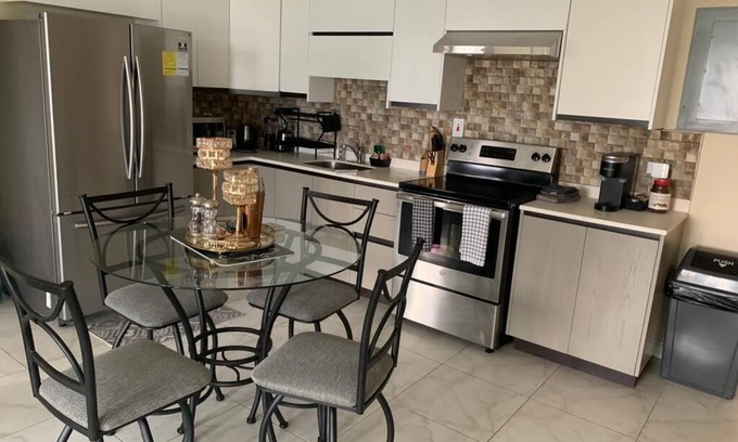 New Kingston Apartment | Cozy 2bedroom condo with 24/7 security, free Wi-Fi, and free Parking.