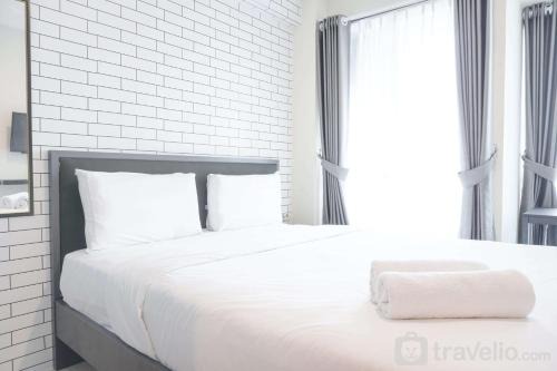 Kayu Putih Apartment | Cozy Studio at Tifolia Apartment By Travelio