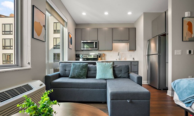 Downtown Minneapolis Apartment | CozySuites Marquee | pool, gym #09