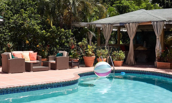 Jack's Hill House | Crowne Gardens. Safe, quiet, luxurious Kingston home with a scenic view.