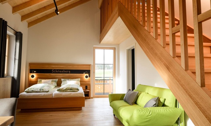 Muenchberg Apartment | Design apartment with gallery and reading corner