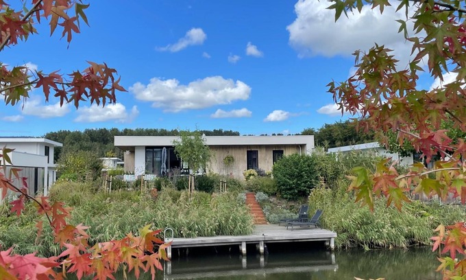 Zeewolde House | Detached 4-person villa with garden by the water, private jetty, fully equipped kitchen, and stylish living room with lots of natural light.