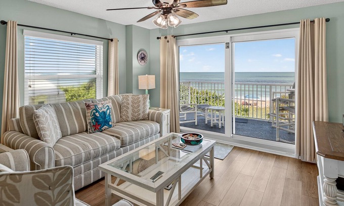 Seawinds Condo Condo | Direct oceanfront corner condo with large balcony, beachfront pool, and garage parking