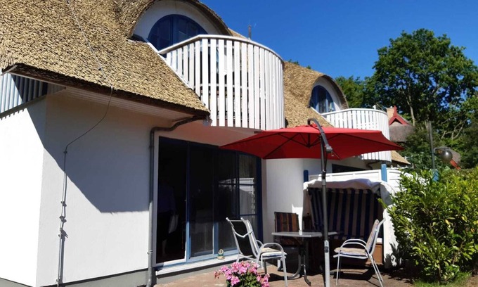 Wieck auf dem Darss Apartment | Don't rush me - modern ground floor apartment with south-facing terrace & beach chair in Wieck a. Darß