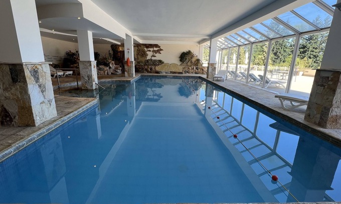 San Carlos de Bariloche Hotel | Elegant Nahuel Huapi Retreat – Spacious Room w/Lake and Garden Views Nearby