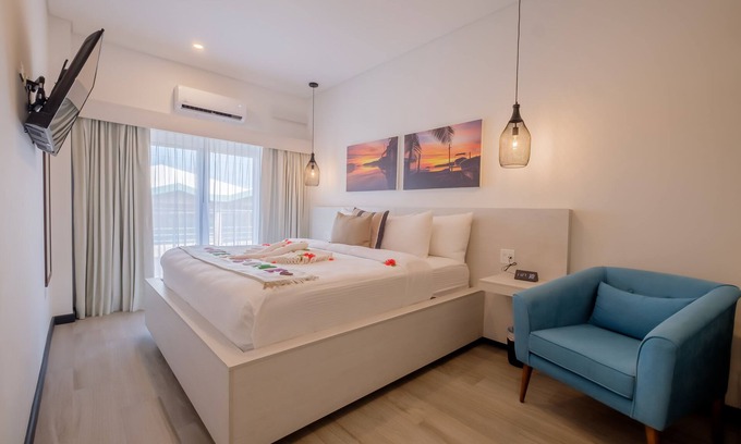 San Pedro Hotel | Enjoy a gorgeous master suite with a full kitchen, king bed, and balcony!