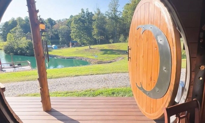 Hamptonville Cottage | Escape to a Hobbit cottage overlooking a pond with water wheel in wine country!