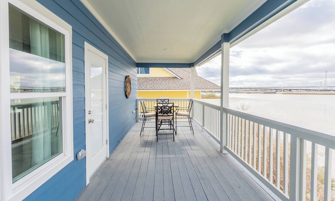El Lago House | Escape to this serene 3-bedroom bayfront retreat in Seabrook Shores. Featuring stunning water views, a spacious deck for sunsets, and cozy coastal interiors, this hideaway is perfect for family getaways or a peaceful escape by the bay