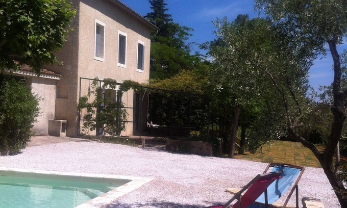 Ecusson House | Family home with character in a quiet, wooded setting.