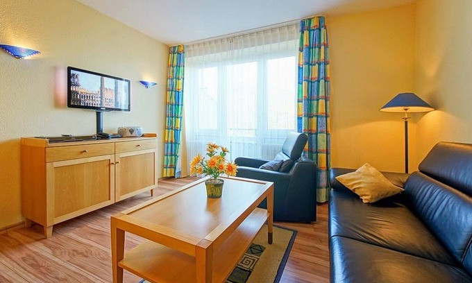 Schillig Apartment | Family maisonette on the North Sea with balcony and view of the green dyke