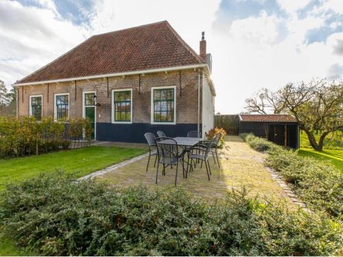 Heinkenszand House | Farmhouse in Zeeland with Windmill Views