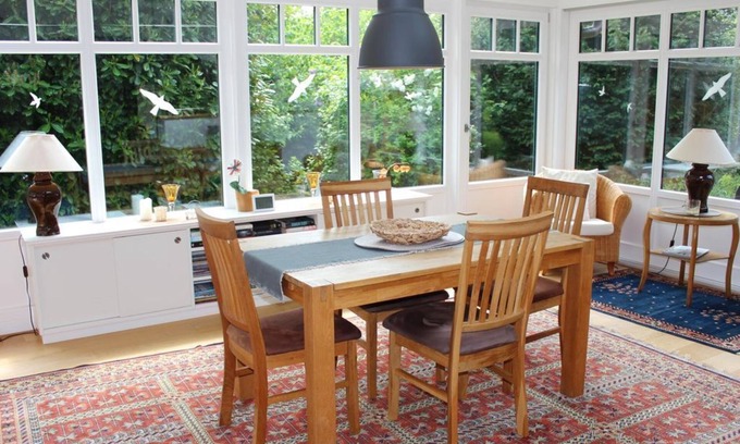 Butjadingen Apartment | Ferienwohnung Wintergarten - Ferienhaus "Am Deich 30"