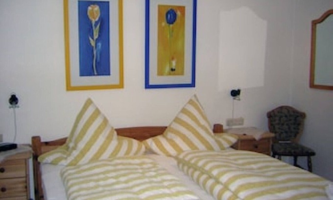 Minheim Apartment | Fewo Kuckucksnest enjoy the morning sun on the balcony.